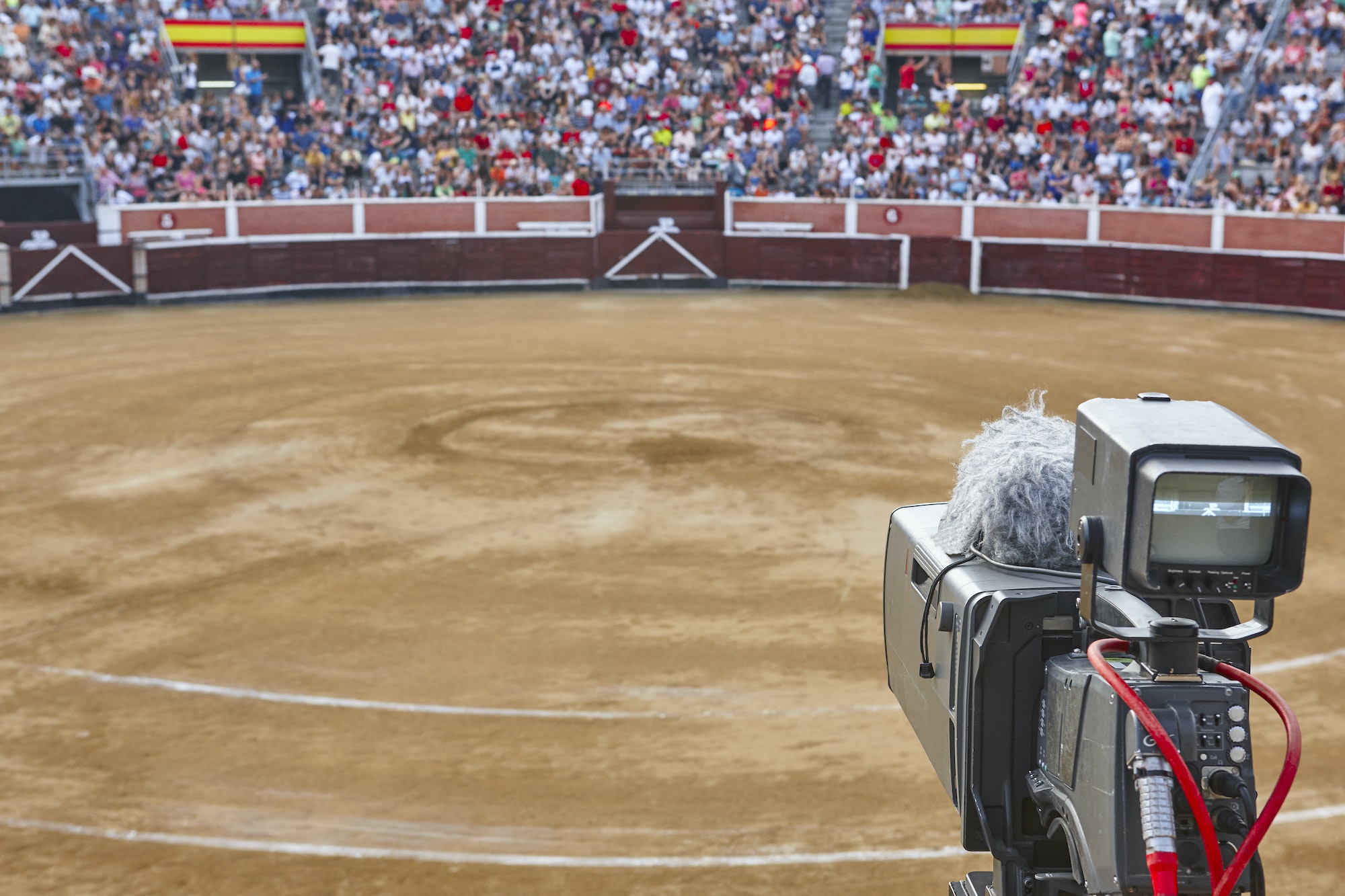 Tv set on a bullring filled with people. Bullfighting, Spain